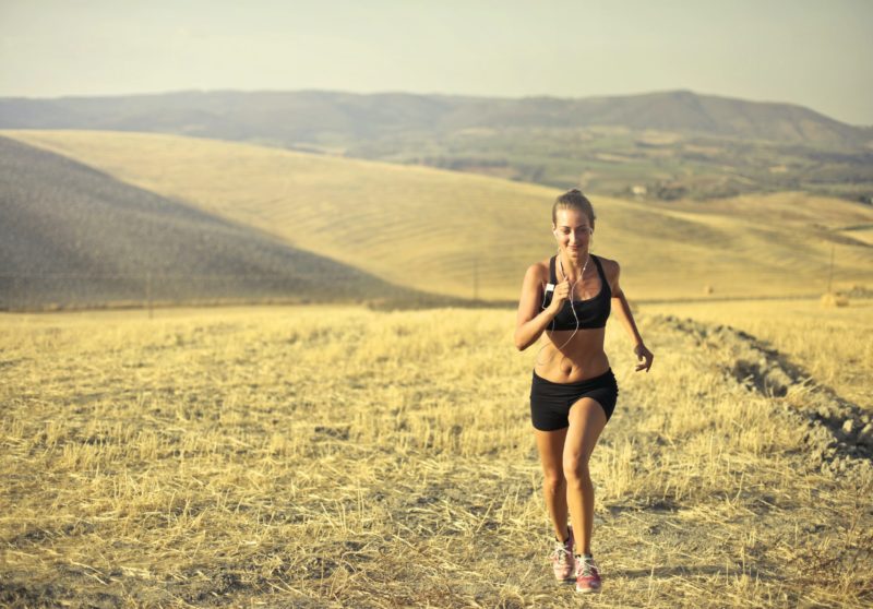 woman running outdoors and she looks healthy