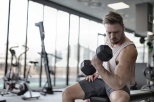 young male adult lifting weights testosterone