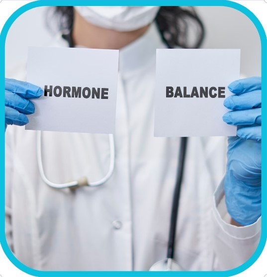 Picture of Doctor holding sign that says, Hormone balance